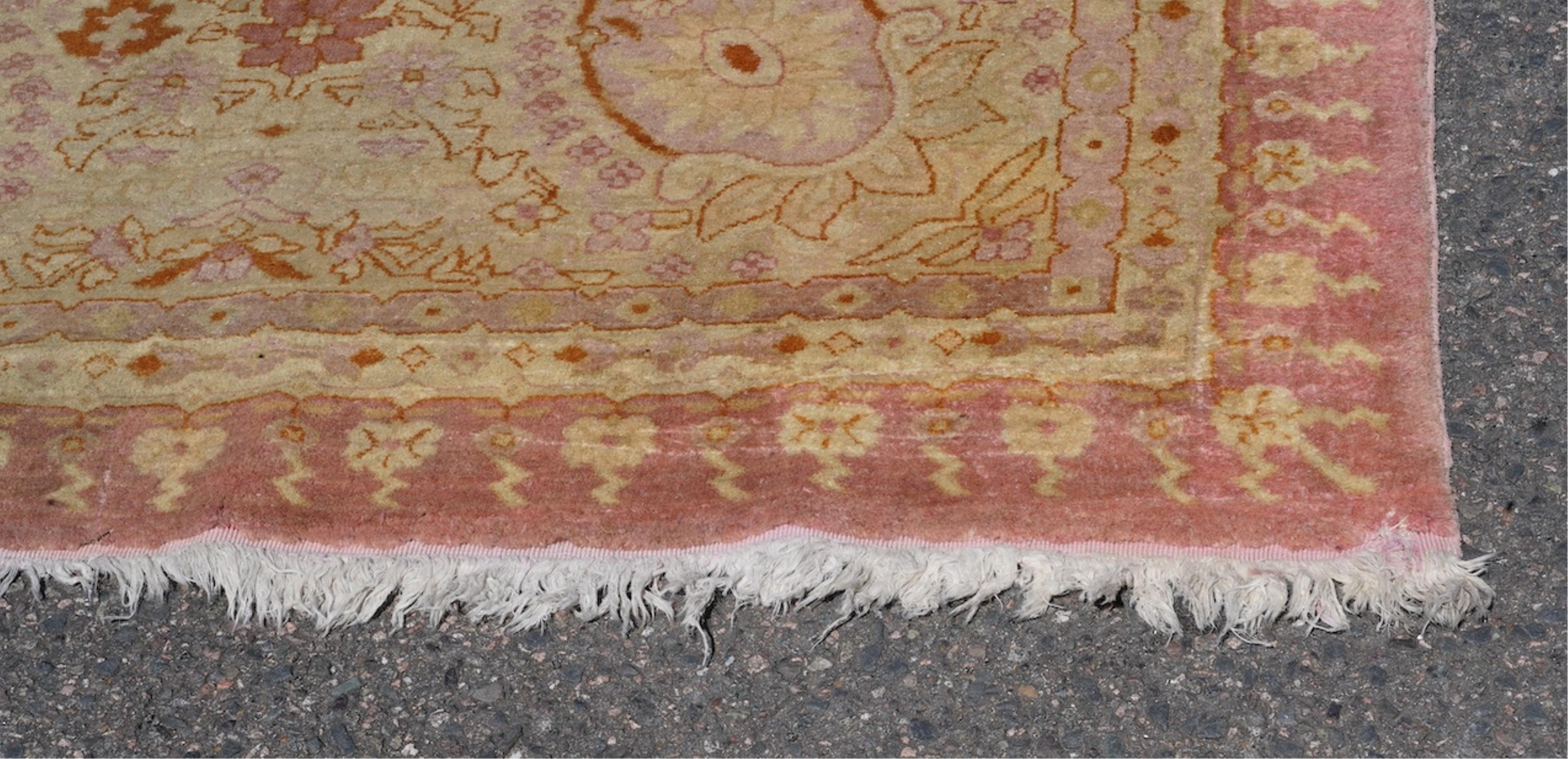 An Amritsar carpet, approximately 580 x 395cm. Condition - fair
